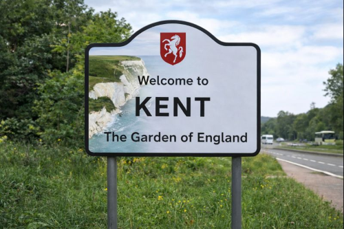Welcome to Kent sign featuring the White Cliffs of Dover and countryside, highlighting Kent as the Garden of England