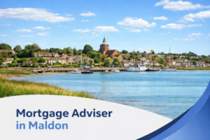 Bright summer daytime view of Maldon waterfront with boats on the River Blackwater, traditional houses and a historic church in the background, featuring a curved white and blue banner with the text “Mortgage Adviser in Maldon” at the bottom.