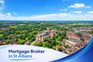Bright summer aerial view of St Albans featuring the cathedral surrounded by green parkland and red brick homes under a clear blue sky, with a white and blue curved banner at the bottom displaying the text “Mortgage Broker in St Albans”.