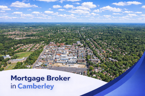 Mortgage broker in Camberley banner showing a bright summer aerial view of the town with surrounding greenery under a clear blue sky with realistic clouds, featuring a curved blue and white overlay with the title text.