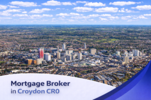 Bright aerial view of Croydon CR0 on a clear summer day, showing a mix of modern high-rise buildings, residential areas, and surrounding greenery under a blue sky with soft, realistic clouds, with a clean curved banner at the bottom displaying the text “Mortgage Broker in Croydon CR0”.