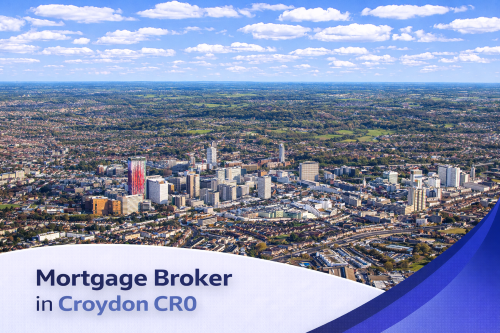 Bright aerial view of Croydon CR0 on a clear summer day, showing a mix of modern high-rise buildings, residential areas, and surrounding greenery under a blue sky with soft, realistic clouds, with a clean curved banner at the bottom displaying the text “Mortgage Broker in Croydon CR0”.