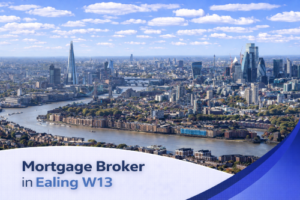 Bright aerial view of Ealing W13 on a clear summer’s day, showing a mix of residential streets, green parks, and distant London skyline under a blue sky with natural, realistic clouds, with a clean curved banner at the bottom displaying the text “Mortgage Broker in Ealing W13”.