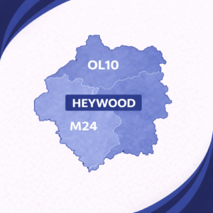 map in layered navy and light blue tones showing Heywood in Lancashire with postcode areas OL10 and M24. The two postcode districts are separated by a white internal boundary and outlined with a darker navy outer edge, labelled in white text. The word “Heywood” appears prominently across the centre within a dark blue banner. The background features curved navy and blue branding elements in the corners, with no surrounding towns or additional geographic detail shown.