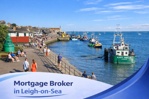 Bright summer view of Leigh-on-Sea waterfront with fishing boats moored in the harbour, people walking along the promenade, and clear blue skies, featuring a white and blue curved banner at the bottom displaying the text “Mortgage Broker in Leigh-on-Sea”.