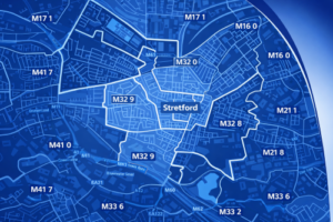 A stylised blue branded map of Stretford in Greater Manchester showing clearly labelled postcode districts including M32 0, M32 8 and M32 9, with surrounding areas such as M16, M21, M41 and M33 also visible, highlighted using dark and light blue tones with white boundary lines.
