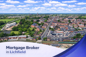 Bright aerial view of Lichfield on a clear summer’s day, showing residential streets, green spaces, and local buildings around a railway line, under a blue sky with soft, realistic clouds, with a clean curved banner at the bottom displaying the text “Mortgage Broker in Lichfield”.