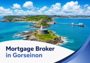 Promotional graphic showing a bright summer aerial view of a rocky coastal headland and turquoise sea, with a white lighthouse in the foreground, a long pier stretching across the bay, green hills and houses in the distance, and a curved white banner at the bottom reading “Mortgage Broker in Gorseinon” in dark and light blue text with matching blue swoosh accents on the right.