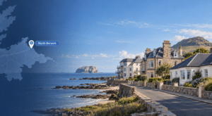 Mortgage Broker in North Berwick, showing a coastal street scene with varied homes, a North Berwick location pin and map, with Bass Rock and North Berwick Law in the background.