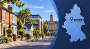 Mortgage Broker in Stafford hero image featuring a Stafford street with varied housing, a local civic landmark, and a Staffordshire map with a Stafford location pin.